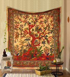 a tapestry hanging on the wall in a room with a rug and potted plant