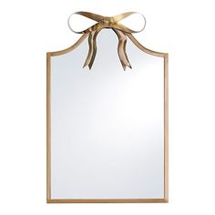 a mirror with a bow on it and a ribbon hanging from the front of it