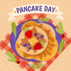 a pancake with berries on top and the words pancake day written above it