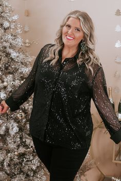 Timeless in sequins, this fully sequined blouse is featured in a true to size fit met with a sheer bodice and elevating holiday focused color tone. We adore the energetic vibe that this piece radiates! Neckline: Button up with collar Fabric: 100% Polyester Details: Sheer sequin detailing throughout, button down bodice, collared neckline Imported Fit: True to size!- Arms: Relaxed- Chest: Relaxed- Minimal stretch Model Specs: Syd is wearing a size XL in the photo.How will this item fit you? Check out our MODEL SPECS(Typical Sizing - Karli: S-Size 5/26 - 5ft 2in, Emily: S-Size 3/25 - 5ft 5in, Syd: L/XL- Size 15/ - 5ft 8in)Need help with sizing? No problem! Join our VIP group on Facebook, Everyday Chic Boutique VIP Insiders to chat directly with our team and other customers just like you.Packa Jollywood Nights, Sequined Blouse, Style Wide Leg Jeans, Bride Top, Sequin Pants, Exclusive Dress, Everyday Chic, Curvy Dress, Dresses By Length