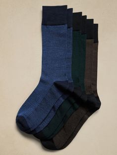 This sock is knitted from our best-selling blend of beautiful Merino wool and modal, which adds softness and a smooth finish.  Sustainability: Made with TENCEL™ modal, sourced from European beechwood trees, harvested from sustainably managed forests.  Set of 3 pairs.  Fits men's shoe sizes 8-12. Handbag Essentials, Men's Shoe, Wool Socks, Dress Socks, Cool Socks, Men Shoes Size, Mens Socks, Mens Fitness, Merino Wool