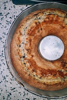 a round cake sitting on top of a metal pan