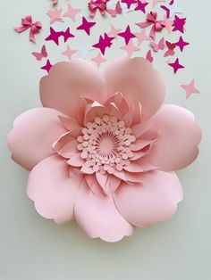 a large pink flower surrounded by stars