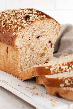 a loaf of bread sitting on top of a cutting board