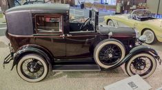 an antique car on display in a museum