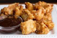 fried food on a plate with dipping sauce