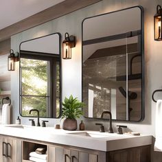 a bathroom with two sinks, mirrors and lights on the wall next to each other