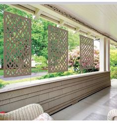 an outdoor covered porch with wicker chairs and privacy screens on the wall, along with pink flowers