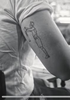 a man with a tattoo on his arm