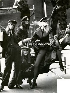 vintage black and white photograph of women in costume posing for a fashion magazine cover photo