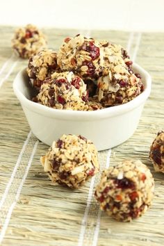 a bowl filled with granola balls sitting on top of a table