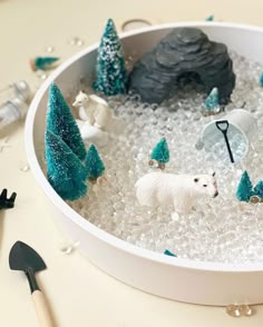 a bowl filled with ice and fake animals