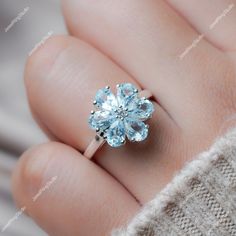 Gemstone : Natural Sky Blue Topaz Metal : 14K White Gold / 14K Rose Gold / 14K Yellow Gold / 925S Silver Gemstone Shape and Size : Pear 6x4 MM Gemstone Weight : 2.50 Ctr Metal Weight :  3.30 Gram ACCEPT CUSTOM SERVICE 1. Accept change main stone type, size :  Pear 6x4 MM 2. Accept change other material : This jewelry can also be made in solid gold (14K white/rose/yellow gold...) Please contact me if you have special requests. Thanks for your visiting! Fine Jewelry For Anniversary In Light Blue, Blue Topaz Diamond Promise Ring, Light Blue Diamond Promise Ring, Light Blue Gemstone Jewelry For Anniversary, Wedding Jewelry With Light Blue Center Stone, Light Blue Jewelry With Center Stone For Wedding, Light Blue Wedding Jewelry With Center Stone, Blue Flower Ring For Wedding Fine Jewelry, Light Blue Jewelry With Accent Stones For Anniversary