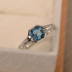 This ring features a 6*6mm asscher cut london blue topaz and sterling silver finished with rhodium. Customization is available. It is made by hand, and it will take about 7 days to finish the ring after your payment is completed. Any question, just let me know. :) My shop homepage: https://www.etsy.com/shop/LuoJewelry?ref=l2-shopheader-name Luo Jewelry, Cushion Cut Halo Ring, Emerald Cut Solitaire Ring, Wholesale Jewelry Supplies, Mystic Topaz Ring, Pear Cut Engagement Rings, Ring Rosegold, Birthstone Rings, Zierlicher Ring