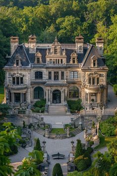 this is an aerial view of a large house in the middle of trees and bushes