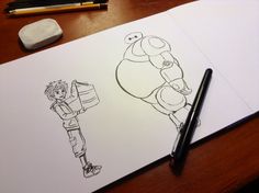 a drawing of a cartoon character next to a pen and paper on a wooden table