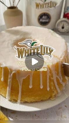 a white jelly pound cake with icing on a plate