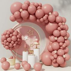 pink balloons and decorations on a table