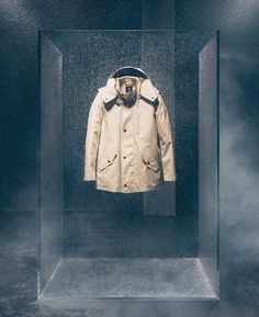 an image of a coat in a glass case with fog coming out from behind it