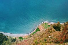 an aerial view of the ocean and land