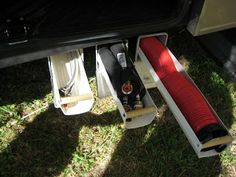 the bottom part of a car with its door open and red linings on it