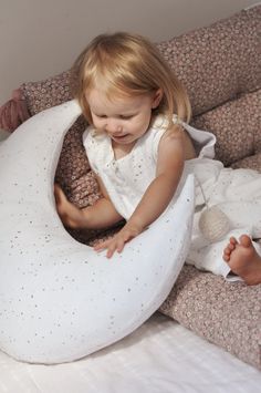 Lilymer moon shaped nursing Pillow is not only a useful accessory while breast feeding but also an adorable addition to your interiors. It is equipped with a zippered cover to be easy removable and washable, it is ergonomically designed to fit the natural contours of a woman's body to relieve the nursing and feeding discomfort, and it is also cute decoration in neutral colors fitting every interior. The pillowcase is made of soft and delicate muslin, cotton fabric comforting to baby skin, filled Baby Nursing Pillow, Organic Cotton Pillows, Moon Pillow, Feeding Pillow, Baby Pillow, Natural Contour, Nursing Pillow, Baby Pillows, Tummy Time