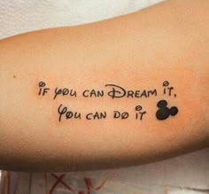 a person with a tattoo on their arm that says if you can dream it, you can do it