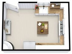 an overhead view of a living room and dining area in a small apartment with wood flooring