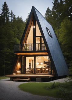 a - frame cabin in the woods at night