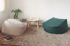 a living room with a bean bag chair and coffee table