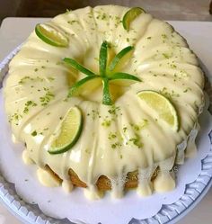 a cake with limes on it sitting on a plate