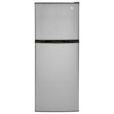 a silver refrigerator freezer sitting on top of a white wall