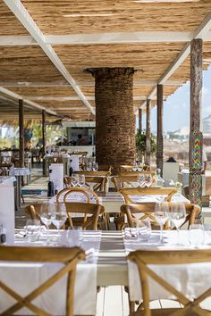 an outdoor dining area with tables and chairs