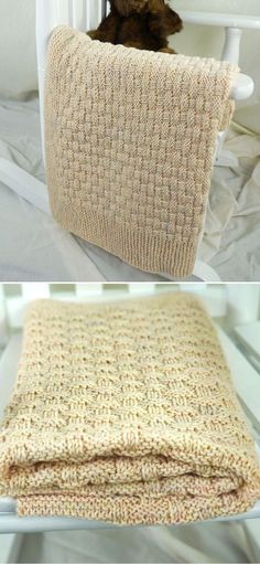 a teddy bear sitting on top of a white chair next to a crocheted blanket