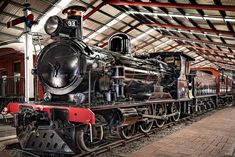 an old train is parked in the station