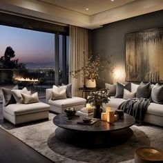 a living room filled with lots of furniture and a large window overlooking the city at night