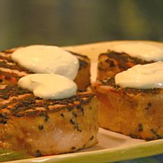 some food is sitting on a plate with green beans