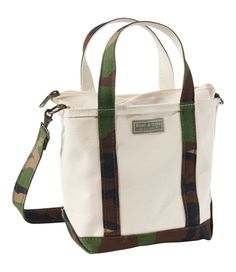 Introduced in 1944 as "Bean's Ice Carrier, " the beloved Boat and Tote is still crafted in Maine, one tote at a time. This 80th anniversary edition celebrates its classic style, legendary durability and the adventures to come. Spot clean. Hanging pocket inside. Adjustable, removable shoulder strap. Double-layer base. Zip-top closure. Heavy-duty 24 oz. cotton canvas. Reinforced flat canvas bottom. Add a monogram for a personal touch (or the perfect gift). Exclusive Boat and Tote® 80th Anniversary Llbean Tote, Boat And Tote, Business Laptop Bag, 80th Anniversary, Backpacking Gear, Crossbody Tote Bag, Gear Bag, Travel Tote, Crossbody Tote