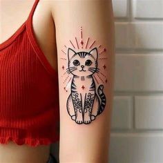 a woman's arm with a cat tattoo on the left side of her body