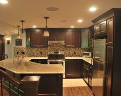 a large kitchen with an island in the middle