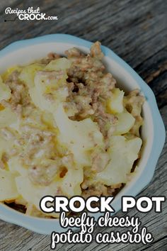 crock pot beef cheese potato casserole in a blue bowl on a wooden table