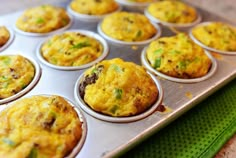 a muffin tin filled with some tasty looking food