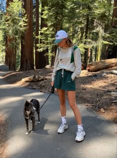 Unleash your inner fashionista on the trails with these stylish hiking outfits for women! Whether it's spring or summer, these cute looks will elevate your outdoor experience. For example, we love this casual ensemble with green shorts, which also doubles up as a dog walking outfit! Hiking Outfits Aesthetic, Outdoorsy Outfits Summer, Hiking Shorts Outfit, Hike Outfit Summer, Summer Hiking Outfit Women, Casual Hiking Outfit