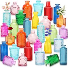 many different colored glass vases and jars