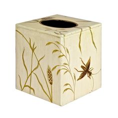 a white tissue box with an insect painted on it