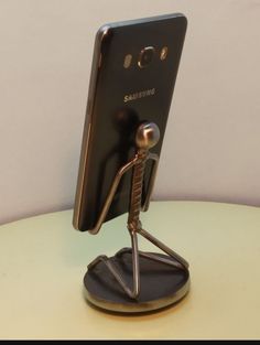 an image of a cell phone holder on a table