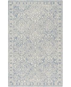 a blue and white rug with an intricate design on the bottom, in front of a white background