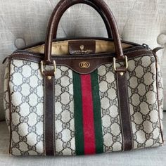 Vintage Authentic Gucci Boston Bag In Great Used Condition. Some Wear On The Piping, But Otherwise In Great Shape! Offers Welcome! Pre-owned Classic Gucci Bags, Designer Gucci Satchel With Branded Hardware, Gucci Elegant Monogram Canvas Satchel, Elegant Gucci Monogram Canvas Satchel, White Gucci Shoulder Bag With Handles, Luxury Pre-owned Satchel Bag, White Gucci Bag With Handles, Pre-owned Designer Satchel Bag, Designer Pre-owned Satchel Bag