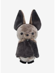 a small stuffed animal with ears on it's head