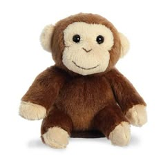 a small stuffed monkey sitting up against a white background